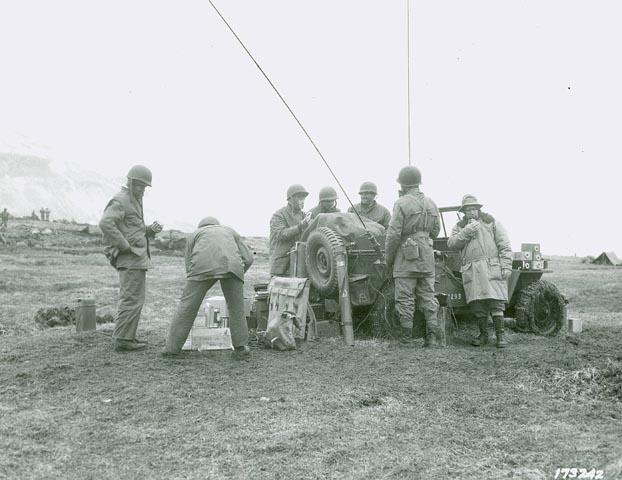 A Jeep loaded with radio and telephone equipment being used as a forward command post for a US Army artillery division, Territory of Alaska, 1943