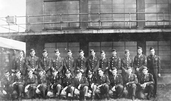 Control tower personnel in front of the tower at RAF Thurleigh, Bedfordshire, England, circa 1944.