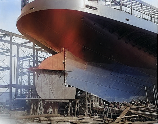 Sidewheeled steamship Seeandbee being converted into the training aircraft carrier USS Wolverine In Buffalo, New York, United States, Aug 1942.  Note the conspicuous absence of a propeller. [Colorized by WW2DB]