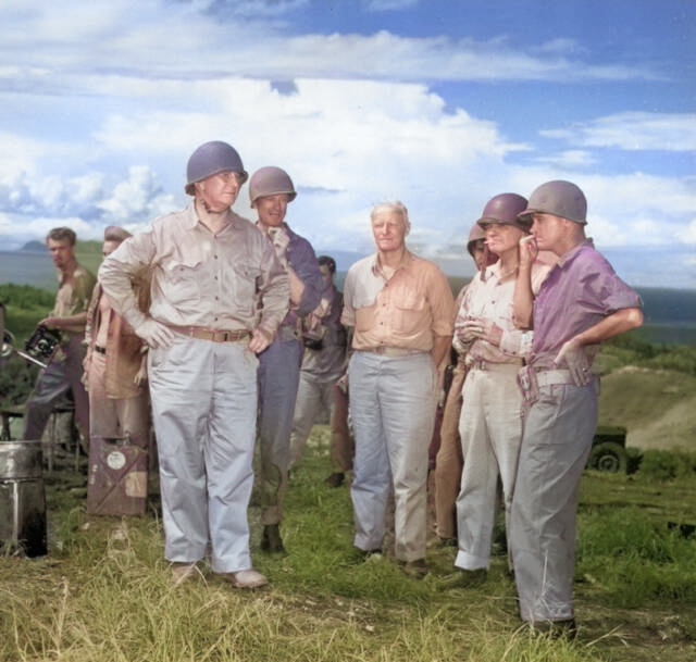 Secretary of the Navy Frank Knox, left, touring Guadalcanal with Adm Nimitz, Adm Halsey, and Army Gen J Lawton Collins, Jan 21, 1943. Apparently no one thought to tell Knox his helmet was on backwards. [Colorized by WW2DB]