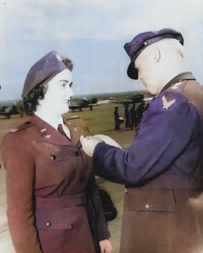 WASP pilot Barbara Erickson being awarded the Air Medal from the Army Air Forces Commanding General, Henry “Hap” Arnold, during the graduation ceremony for WASP cadet class 44-W-2, Avenger Field, Texas, 11 Mar 1944 [Colorized by WW2DB]