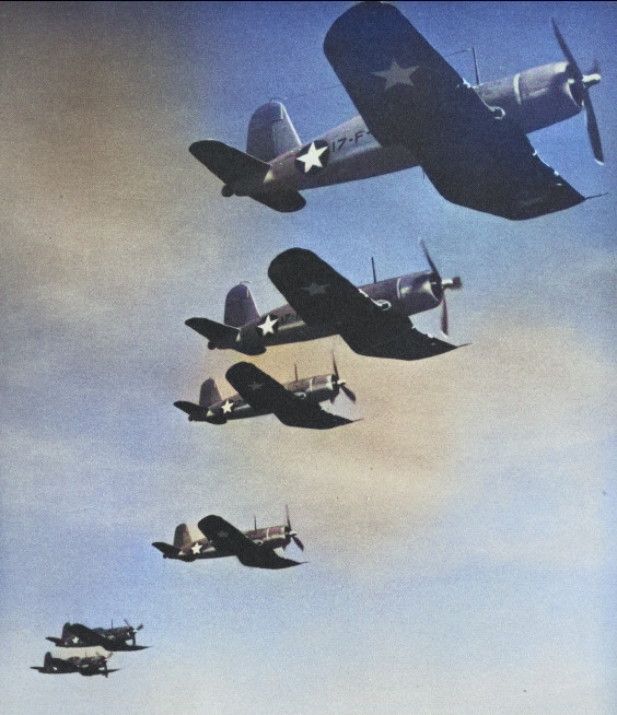 F4U-1 Corsair fighters of US Navy VF-17 squadron in flight, 1943; seen in 15 Jul 1943 issue of US Navy publication US Naval Aviation News [Colorized by WW2DB]