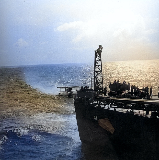 SOC Seagull aircraft being recovered by cruiser Philadelphia, off North Africa, Nov 1942, photo 1 of 4 [Colorized by WW2DB]