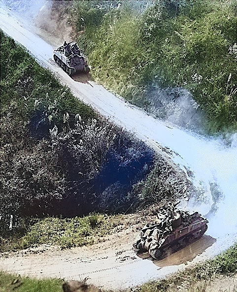 American- and Chinese-manned M4 Sherman tanks on the Burma Road, circa 1945 [Colorized by WW2DB]