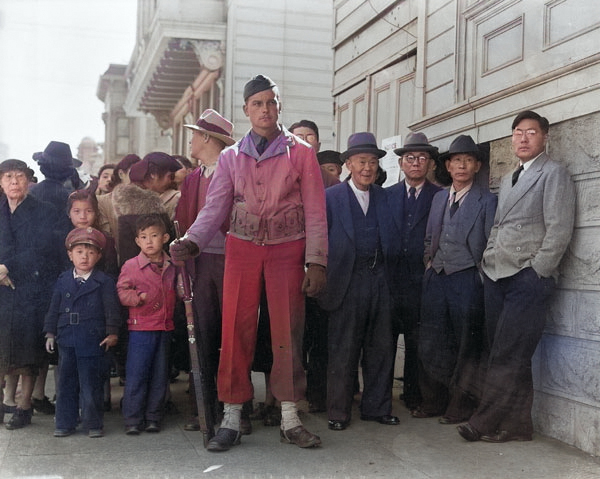 A crowd of onlookers on the first day of evacuation of Japanese residents of San Francisco, California, United States, who themselves would be sent to internment camps within three days, 25 Apr 1942 [Colorized by WW2DB]