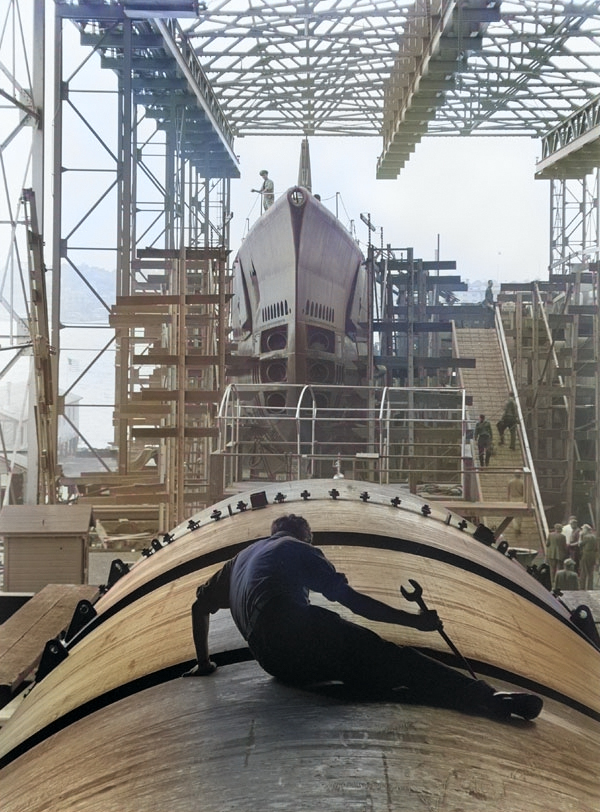 Man working on hull of US submarine at Electric Boat Company, Groton, Connecticut, United States, Aug 1943 [Colorized by WW2DB]