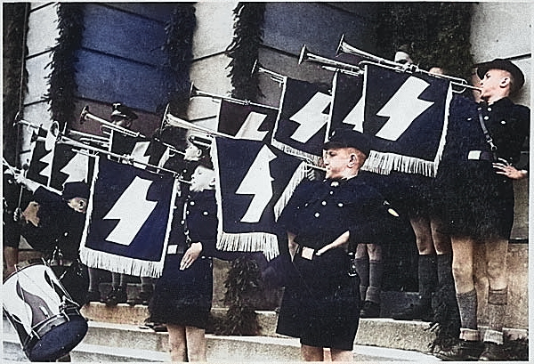 Hitler Youth Hour of Commemoration in front of the Town Hall in Tomaszow, occupied Poland, 11 May 1941 [Colorized by WW2DB]