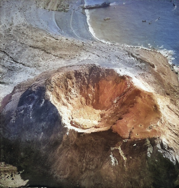 Aerial photograph of Mount Suribachi with Iwo Jima's Beach Green One beyond, circa 20-28 Feb 1945 [Colorized by WW2DB]