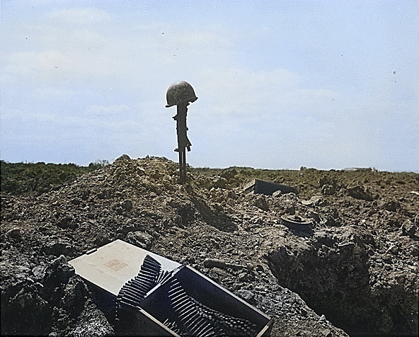 A makeshift monument to a fallen American soldier at Normandy, France, Jun 1944 [Colorized by WW2DB]