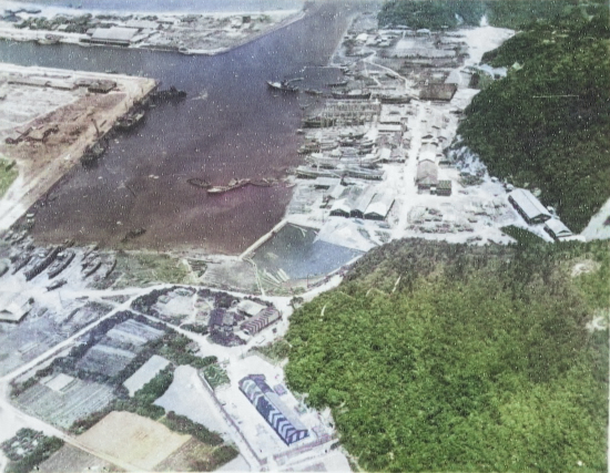 Suo (now Suao) harbor under attack by a PB4Y-1 aircraft of US Navy squadron VPB-104, eastern Taiwan, 22 Apr 1945, photo 3 of 4 [Colorized by WW2DB]