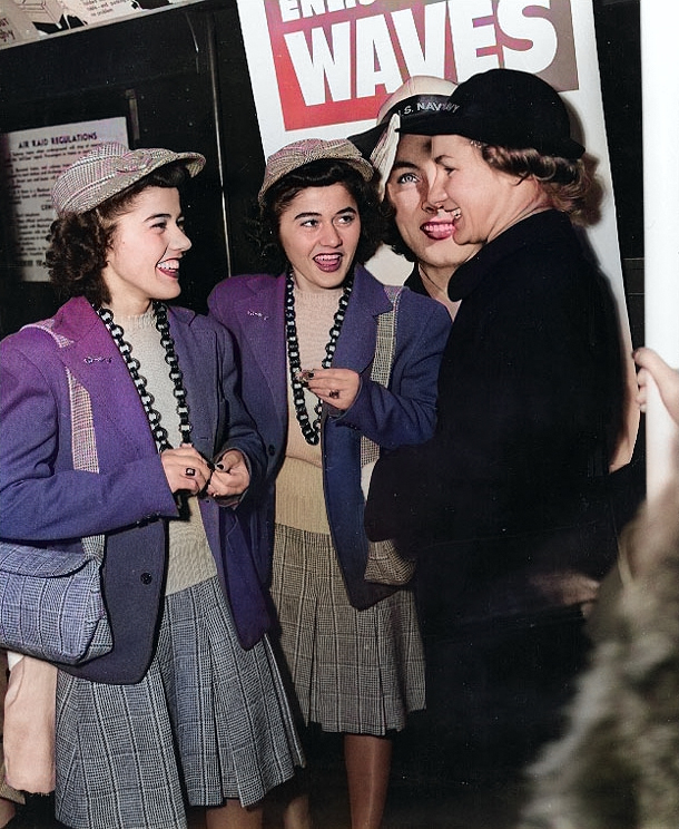 Twin sisters Ann Louise Budnick and Jule Louise Budnick talking with a WAVE personnel, New York City, New York, United States, 8 Feb 1943 [Colorized by WW2DB]