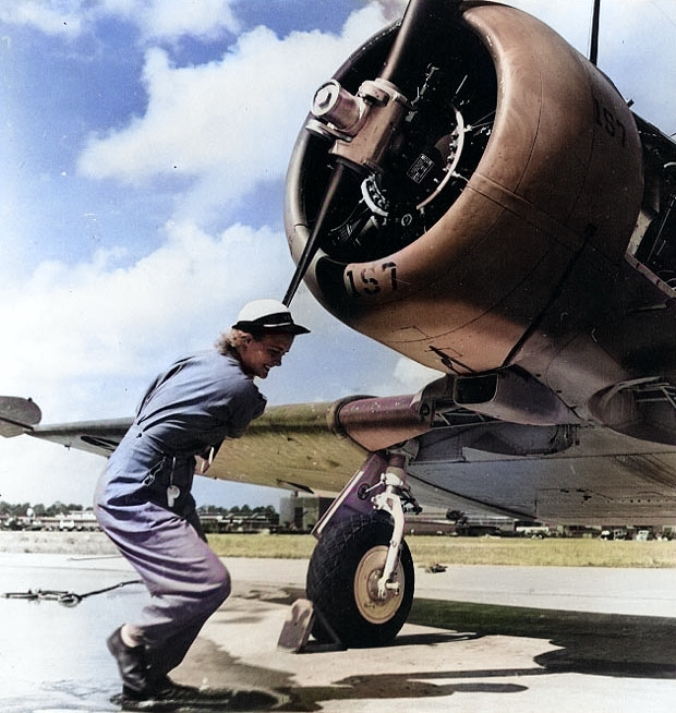 WAVES Aviation Machinist's Mate 3rd Class Violet Falkum turning the Pratt & Whitney R-1340 radial engine of a SNJ-4 training plane, Naval Air Station, Jacksonville, Florida, United States, 30 Nov 1943 [Colorized by WW2DB]