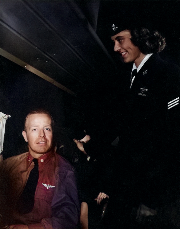 WAVES Seaman 1st Class Patricia A. Branch attending to an officer aboard a Naval Air Transport Service flight, circa mid-1945 [Colorized by WW2DB]