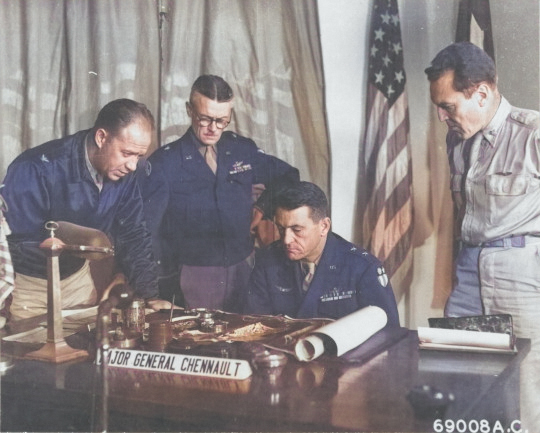 Claire Chennault at his desk with other officers, 1940s [Colorized by WW2DB]