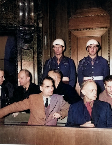 Rudolf Heß and Joachim von Ribbentrop at Nürnberg, Germany, 1946 [Colorized by WW2DB]