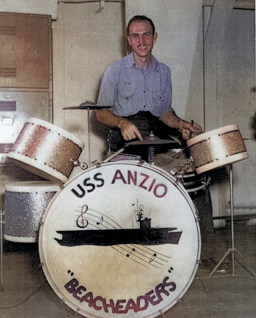 AMM 3rd Class L. H. McDowell at the drums during an orchestra performance aboard USS Anzio, 18 Feb 1945 [Colorized by WW2DB]