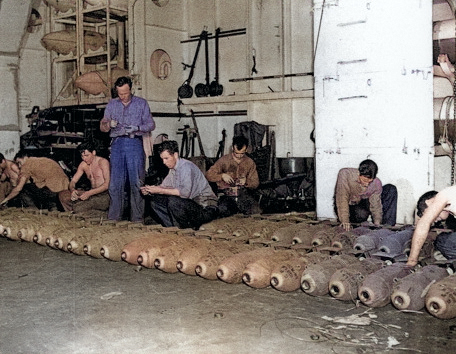 Men fusing bombs aboard USS Anzio, 20 Apr 1945 [Colorized by WW2DB]