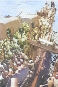 Survivors of USS Helena being transferred from destroyer USS Nicholas to cruiser USS Honolulu, Tulagi, Solomon Islands, 6 Jul 1943, photo 1 of 3 [Colorized by WW2DB]