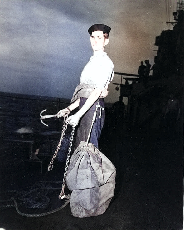 Recruit of Indianapolis on 'mail buoy watch', 10 Mar 1943 [Colorized by WW2DB]