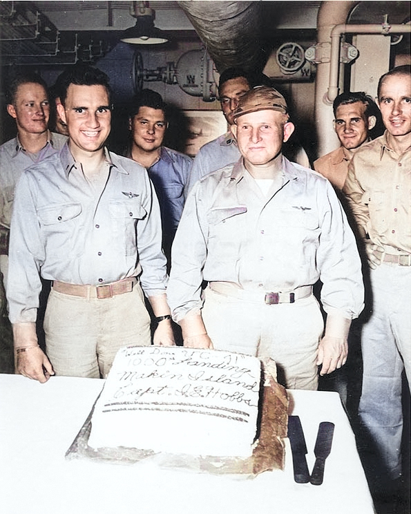 Captain Ira E. Hobbs, USS Makin Island's Commanding Officer, honored aviators of Composite Squadron 41 on the occasion of their 1,000th landing on board, mid-1945 [Colorized by WW2DB]