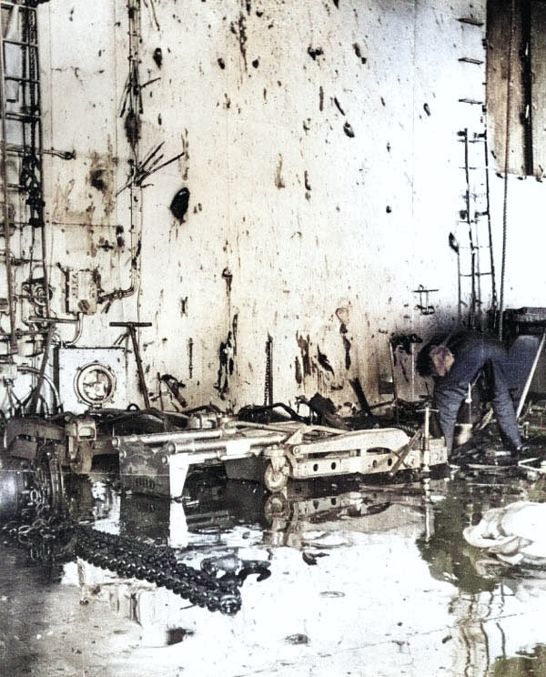 Bomb fragment damage in Yorktown's hangar, 4 Jun 1942 [Colorized by WW2DB]