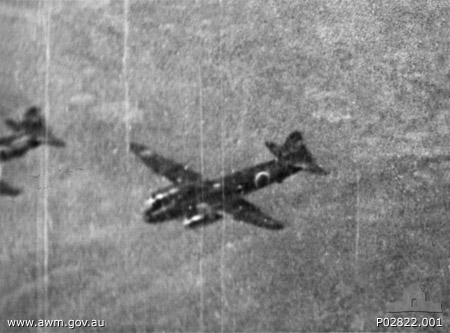 Gun camera still by Flight Sergeant Batchelor No. 457 Squadron RAAF of Japanese G4M1 bombers in flight near Darwin, Australia, 6 Jun 1943