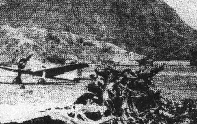 Ki-27 fighter and the wreck of an Eurasia Aviation Corporation Ju 52 passenger aircraft at RAF Kai Tak, Kowloon, Hong Kong, late 1945