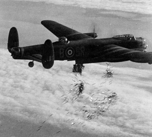 Lancaster B Mark I bomber of No. 101 Squadron RAF (Warrant Officer R. B. Tibbs) dropping up to 108 30-lb 'J' incendiary bombs over Duisburg, Germany during Operation Hurricane, 14 Oct 1944