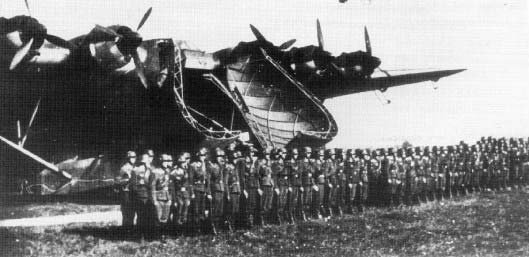 German soldiers being reviewed in front of a Me 323 Gigant aircraft, 1940s