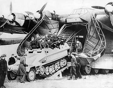 A German armored halftrack vehicle being loaded into the nose doors of a six-engine Luftwaffe Me 323 Gigant transport, date unknown