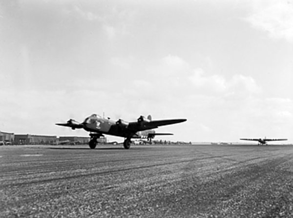 British Stirling Mark IV bomber LK115 '8S-Z' of 295 Squadron RAF taking off from Harwell, Oxfordshire, England, UK towing an Airspeed Horsa glider, 17 Sep 1944