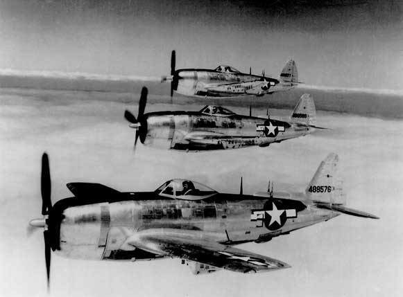 Three P-47 Thunderbolt fighters in flight, circa 1945