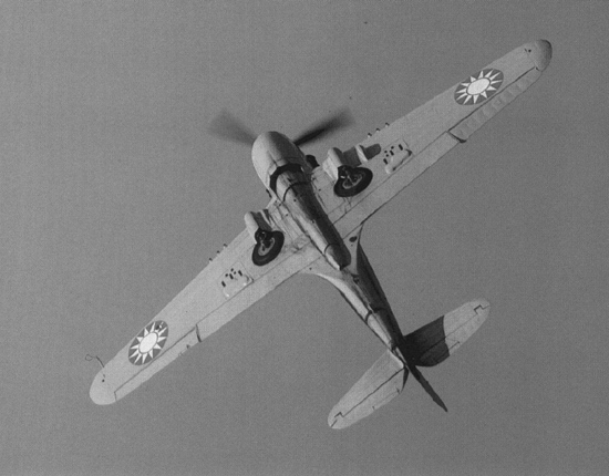 View of the bottom of a Chinese P-40 Warhawk fighter while in flight, China, circa 1940s