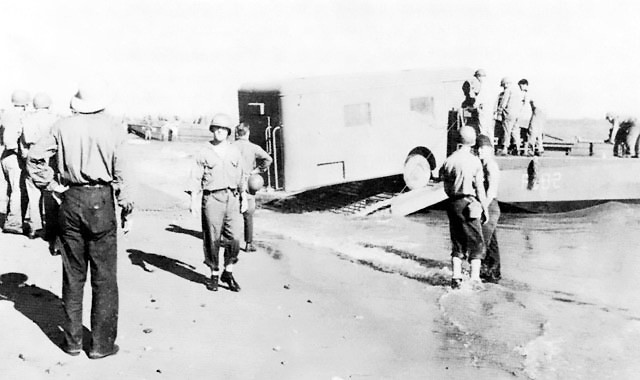 Men and supplies of the 132rd Regimental Combat Team of the US Army Americal Division, Kikum, Guadalcanal, Solomon Islands, 8 Dec 1942