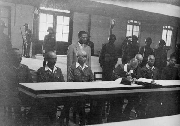 Yasuji Okamura signing the surrender document, Nanjing, China, 9 Sep 1945, photo 2 of 2