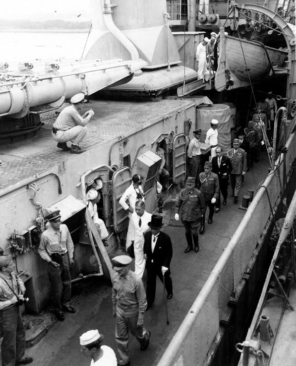 Foreign Minister Mamoru Shigemitsu and General Yoshijiro Umezu led along the deck of destroyer Lansdowne by US Army Colonel Sidney Mashbir after the surrender ceremonies, 2 Sep 1945