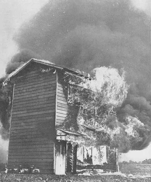 Testing the M-69 incendiary bomb on a model enemy building, Dugway Proving Ground, Utah, United States, 1942-1945