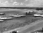 B-17 Fortresses of the 324th Bomb Squadron assembled at RAF Bassingbourn, Cambridgeshire, England, UK, 1944. Note P-51D Mustang in the center of the field.