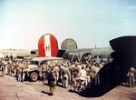 Wounded aircrewmen are helped off B-24H Liberator “Liberty Lib” of the 752nd Bomb Squadron at RAF Horsham St Faith, Norfolk, England, UK after a raid on the Dornier factory at Lubeck, Germany, Aug 25 1944. Note the WC54 Ambulance.