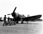 Ground crewmen arming an FG-1D Corsair of Marine Fighting Squadron 312, the “Checkerboarders,” at Kadena airfield, Okinawa, Japan, Apr-Aug 1945