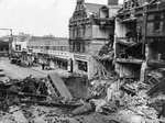 A London bus after falling into a massive bomb crater in the center of Balham High Road, London, England, UK, Oct 15 1940.