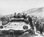 Supreme Allied Commander Dwight Eisenhower touring the Normandy invasion beaches with General George Marshall, Admiral Ernest King, and staff at St Laurent sur Mer, Jun 12 1944.  Photo 2 of 3.