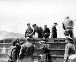 Supreme Allied Commander Dwight Eisenhower touring the Normandy invasion beaches with General George Marshall, Admiral Ernest King, and staff at St Laurent sur Mer, Jun 12 1944.  Photo 3 of 3.