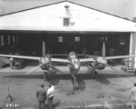 An early, highly polished P-38 Lightning rolls out of the Lockheed hangar in Burbank, California, United States