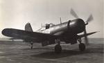 An F4U Corsair running up its engine before taking off from the training aircraft carrier USS Sable on Lake Michigan, United States, 1944-45.