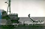 After missing the arresting wires, an FM-2 Wildcat made it almost the length of the flight deck before nosing over aboard the training aircraft carrier USS Sable on Lake Michigan, United States, 1943-45.