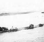 Large Type 2TL tanker Kyokuun Maru on fire and making for the beach off the coast of French Indochina (Vietnam) north of Qui Nhon after its convoy was attacked by 175 United States Navy carrier planes, Jan 12, 1945.