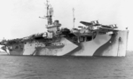 Escort carrier USS Bogue at anchor off Quonset Point, Rhode Island, United States, Feb 1945. Note the 1943 addition of a HF/DF antenna mast forward of the island, essential for Bogue’s mission as a Hunter-Killer ship.