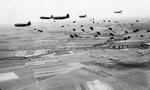 The 17th Airborne Division making a practice jump near Chalon-sur-Saône, France, Mar 11, 1945. Note C-46 Commando aircraft.