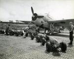 Bombs being brought to a TBF Avenger of United States Navy Torpedo Squadron VT-11 flying from Henderson Field, Guadalcanal, 1942. Note the pierced steel Marsden matting.